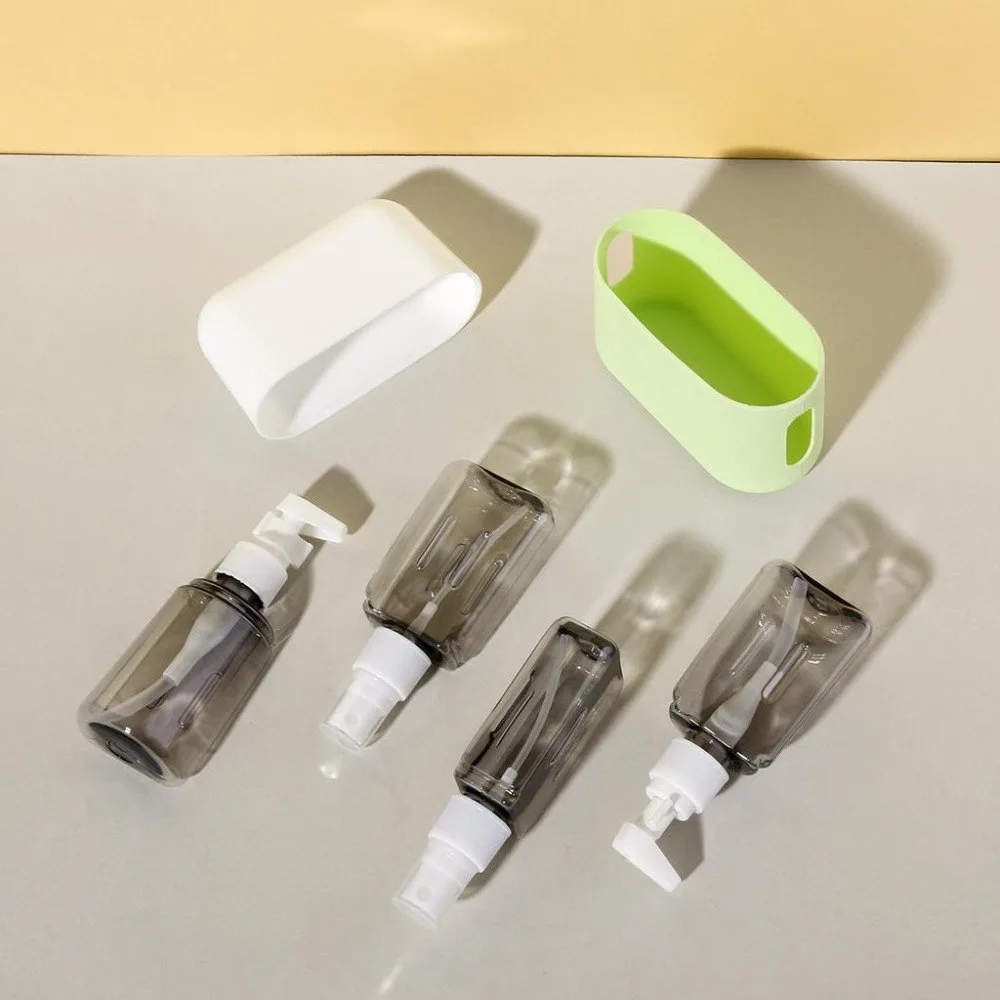 Kit de 4 envases de viaje de 50 ml con estuche